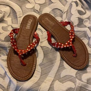 Red Carlos Santana leather flip flops